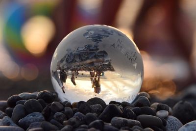 Close-up of crystal ball on stones
