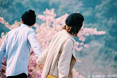 Rear view of couple walking outdoors