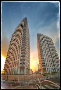 Low angle view of skyscrapers against sky