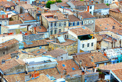 Tiled rooftops of old town . aerial view of red roofs . residential district with old houses