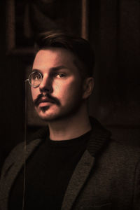 Portrait of young man looking down