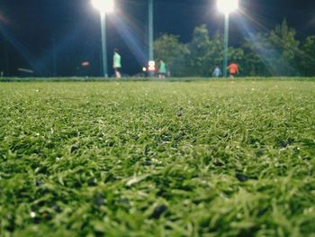 View of soccer field against sky at night