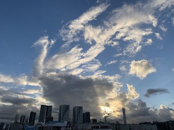 Low angle view of silhouette buildings against sky during sunset