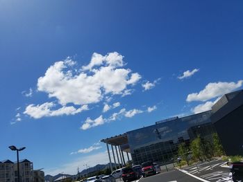 Low angle view of city against blue sky