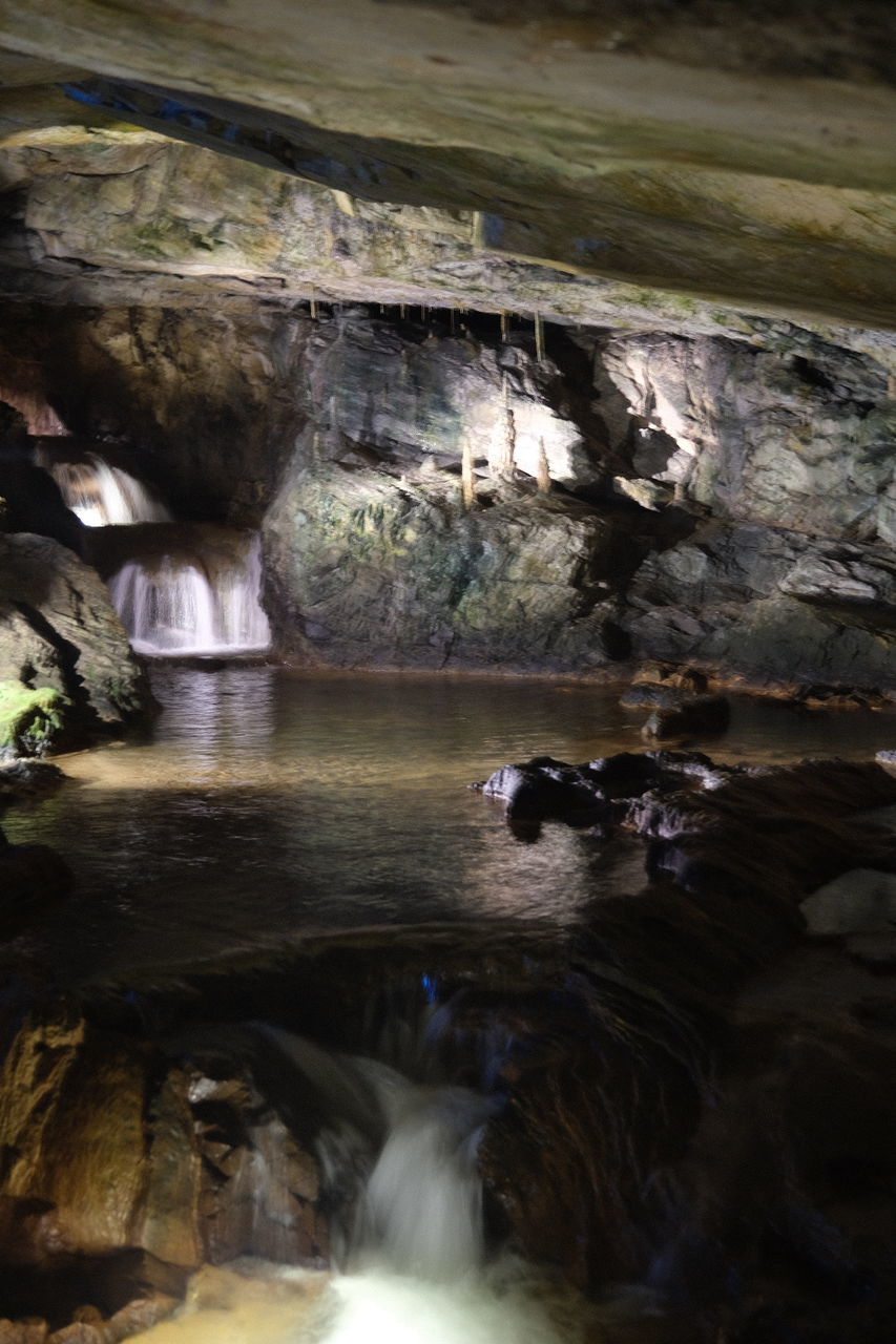 rock, rock formation, rock - object, solid, water, cave, nature, indoors, beauty in nature, geology, day, physical geography, motion, no people, travel, waterfront, blurred motion, eroded, flowing water