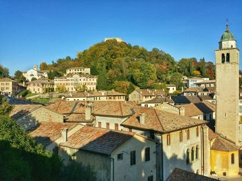 High angle shot of houses against blue sky
