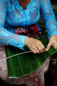 Someone prepares the equipment for the ngaben ceremony in ubud bali indonesia.