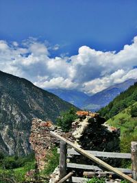 Scenic view of mountains against cloudy sky