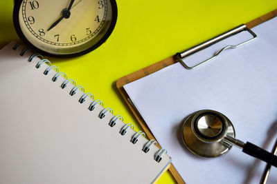High angle view of clock on table