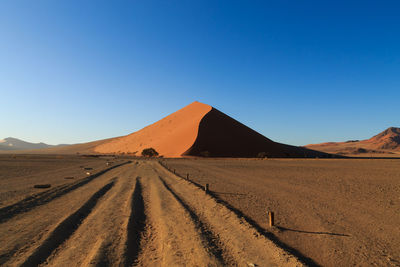 Scenic view of desert against clear sky