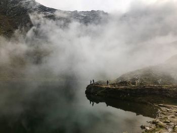 Scenic view of clouds over mountain