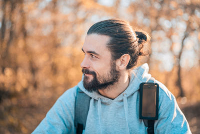 Portrait of young man looking away