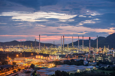 Beautiful sunset petrochemical oil refinery factory plant , cityscape of chonburi thailand at night 