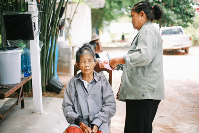 Side view of young man working at park