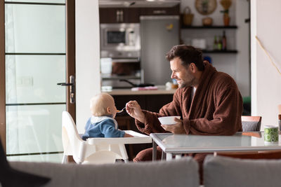 Young woman using laptop at home