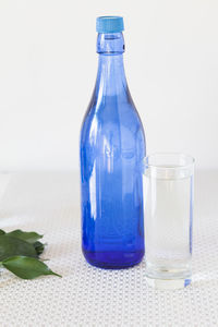 Close-up of glass bottle on table