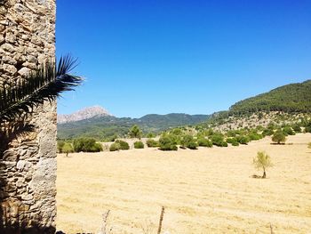 Scenic view of mountains against clear blue sky