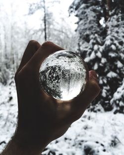 Close-up of human hand holding ice