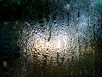 Full frame shot of wet glass window