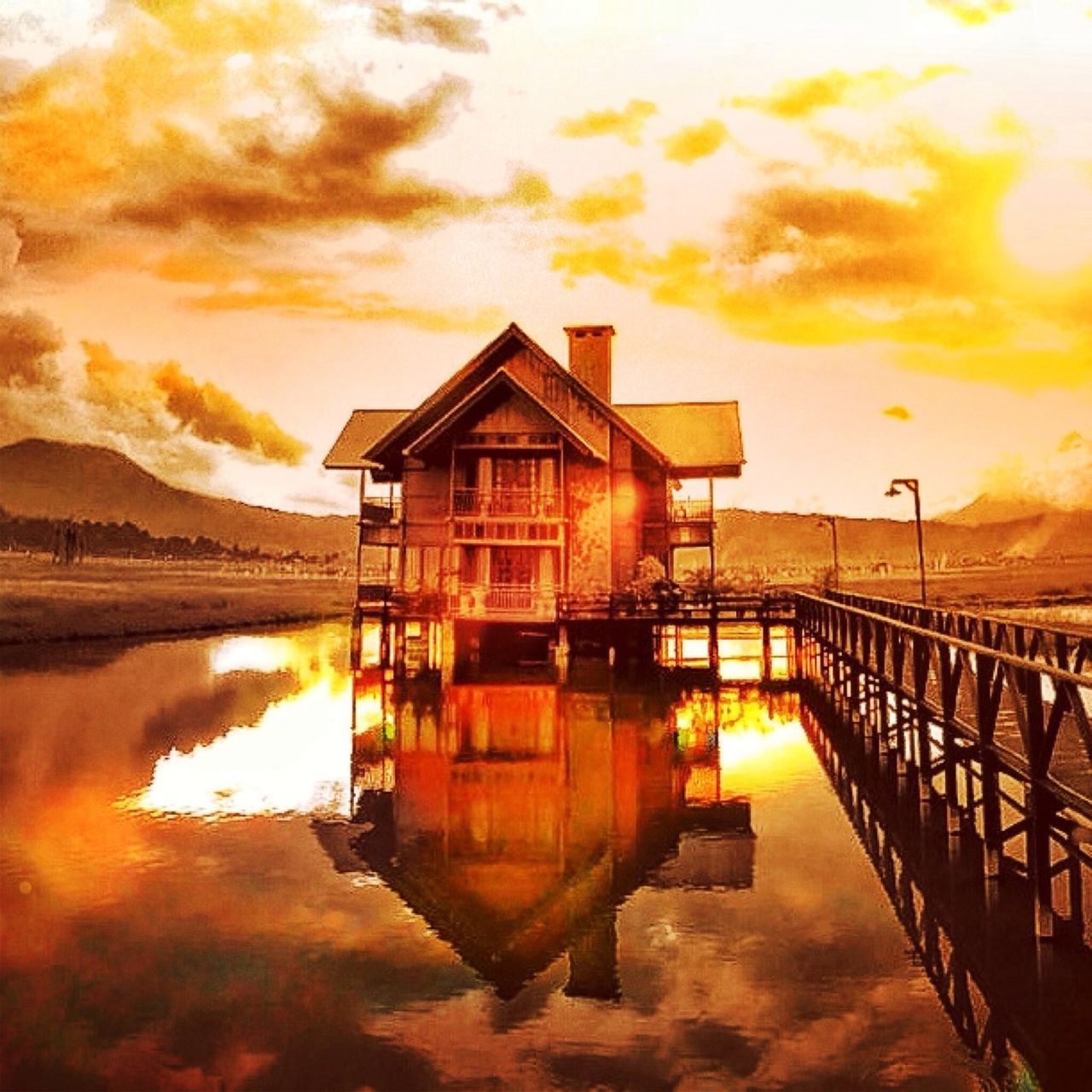 sunset, architecture, built structure, building exterior, water, sky, orange color, cloud - sky, reflection, waterfront, pier, cloud, railing, river, scenics, cloudy, beauty in nature, sea, dramatic sky, lake