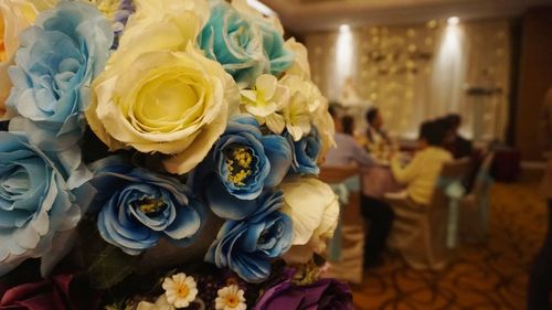 High angle view of people holding rose bouquet