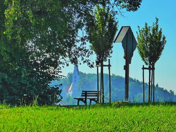 Lifeguard hut on field against sky