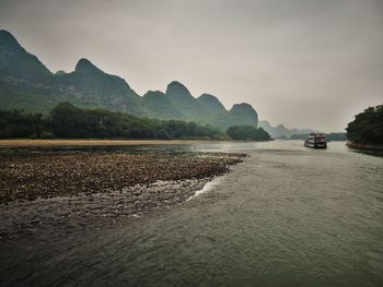 Scenic view of river against sky