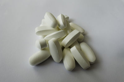 High angle view of white candies on table