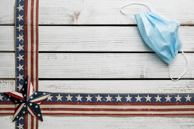 High angle view of flag on table against white wall