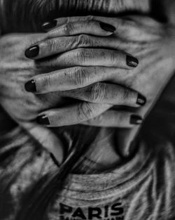 Close-up of man covering face with hand