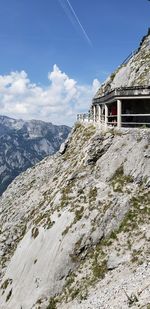 Scenic view of building and mountains against sky