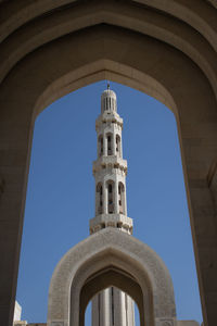 Low angle view of historical building against clear blue sky