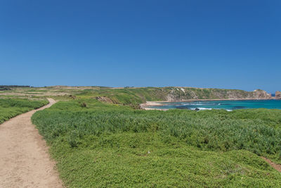 Scenic view of land against clear sky