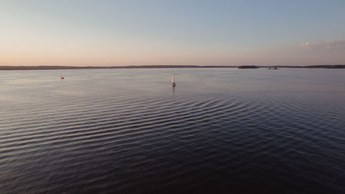 Scenic view of sea against clear sky during sunset