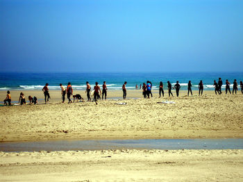 Group of people on calm beach