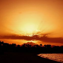 Scenic view of silhouette landscape against romantic sky at sunset