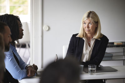 Smiling businesswoman at meeting