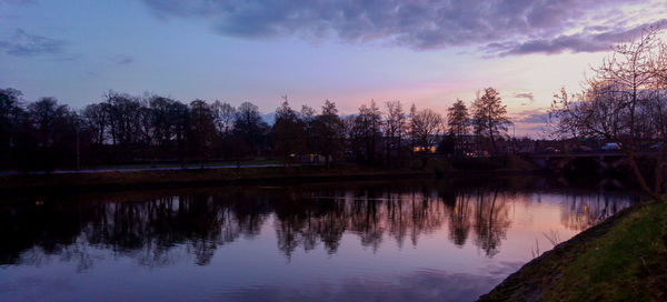 Scenic view of lake at sunset