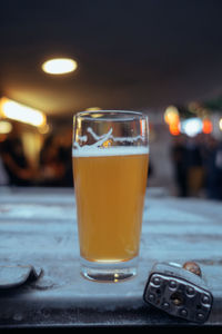 Close-up of beer glass on table