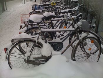 Bicycles parked on snow covered street