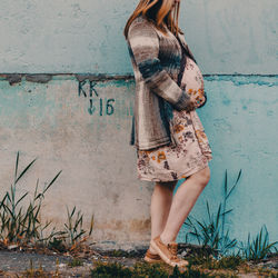 Woman standing with umbrella