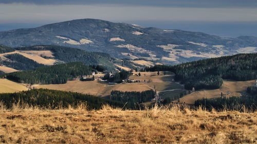 Scenic view of landscape and mountains against sky