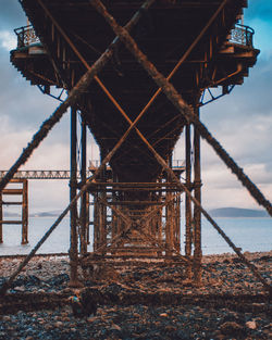 Pier over sea against sky