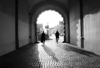 People walking in tunnel