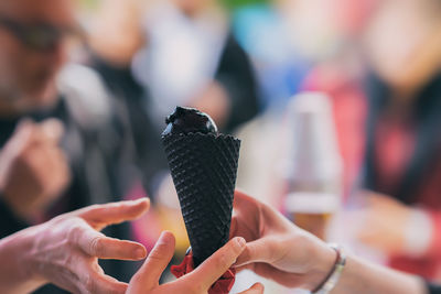 Cropped image of hands holding ice cream