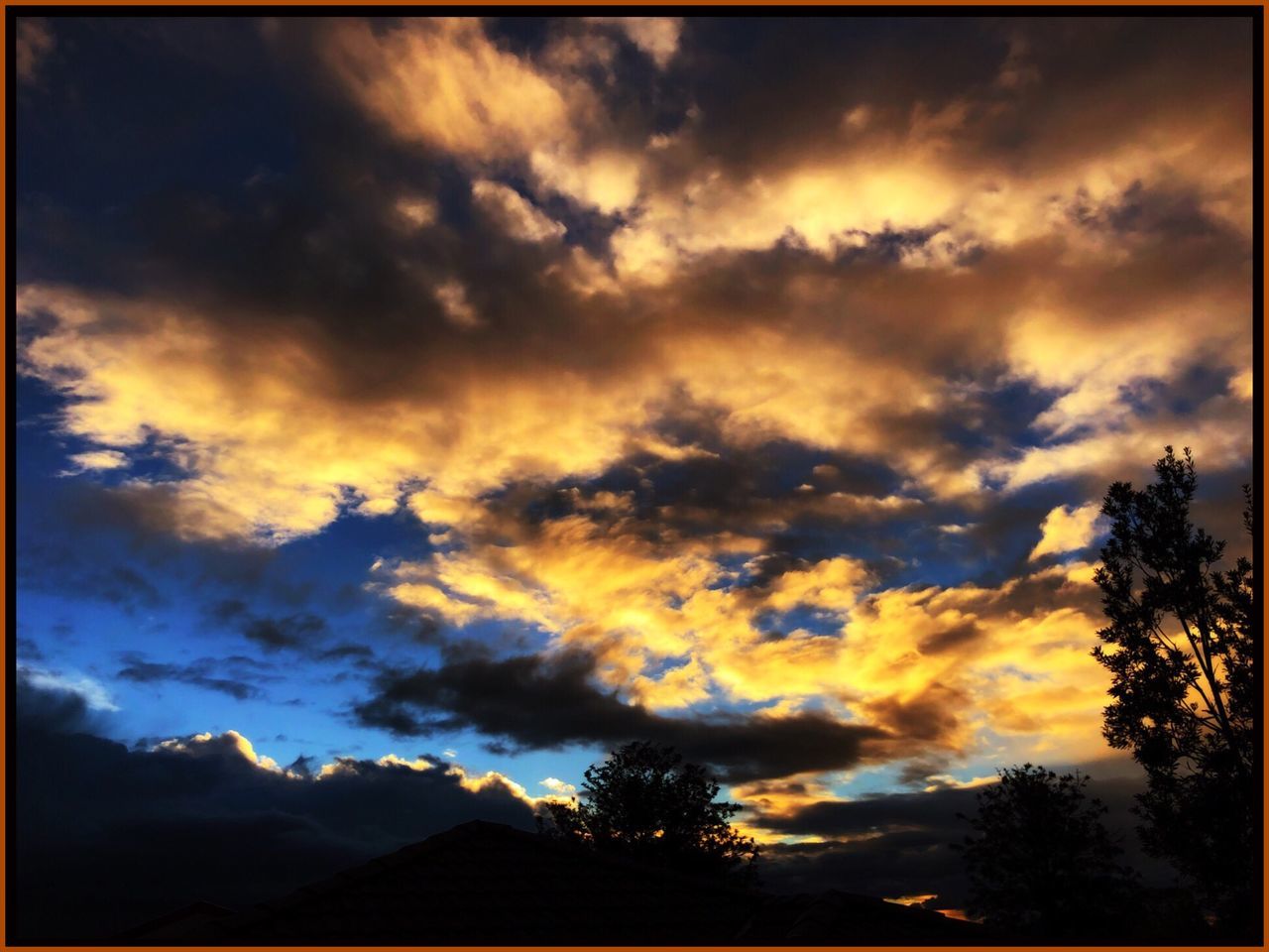 sky, cloud - sky, sunset, beauty in nature, tree, scenics - nature, tranquility, silhouette, tranquil scene, plant, nature, no people, auto post production filter, transfer print, orange color, dramatic sky, outdoors, low angle view, idyllic, ominous