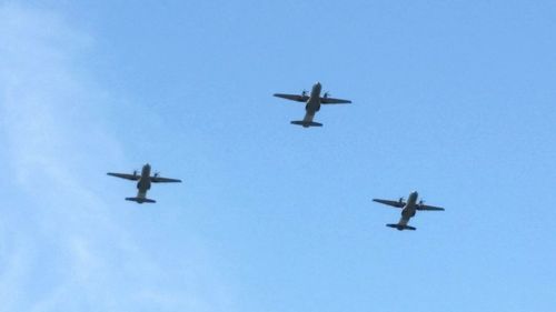 Low angle view of airplane flying in sky