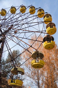 Low angle view of ferris wheel against sky