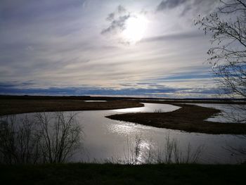 View of lake against cloudy sky