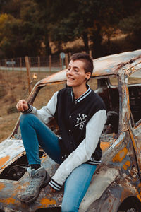 Young man sitting outdoors